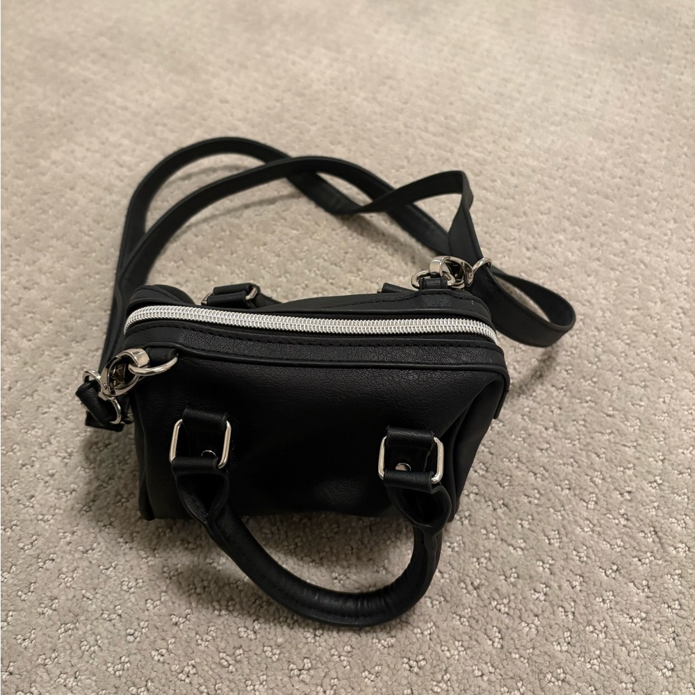 Small black crossbody bag with silver hardware!